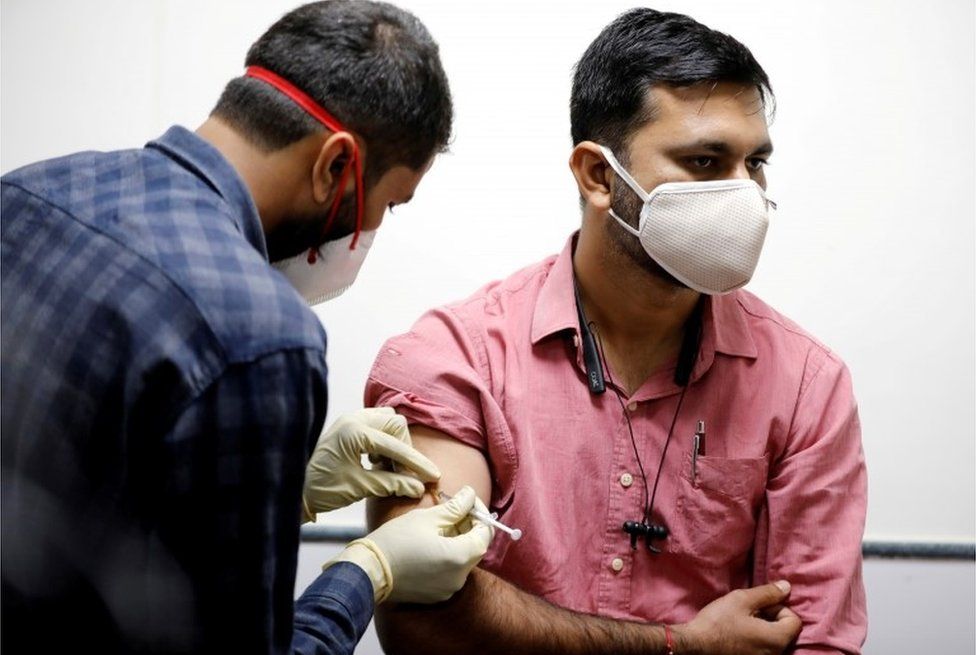 A medic administers COVAXIN, an Indian government-backed experimental COVID-19 vaccine, to a health worker during its trials, at the Gujarat Medical Education ^ Research Society in Ahmedabad, India, November 26, 2020