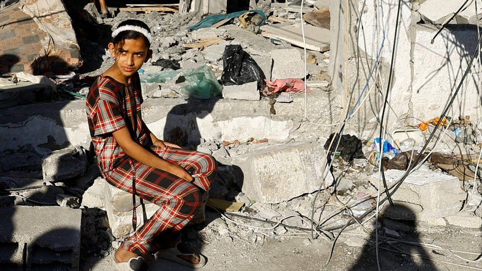 A Palestinian girl reacts at the site of an Israeli strike on a house in Rafah