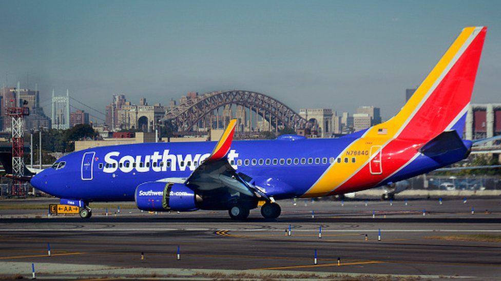 A Southwest Airlines passenger jet lands at LaGuardia Airport in New York