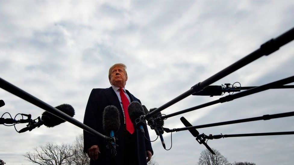 US President Donald Trump speaks to the media as he departs the White House in Washington, DC