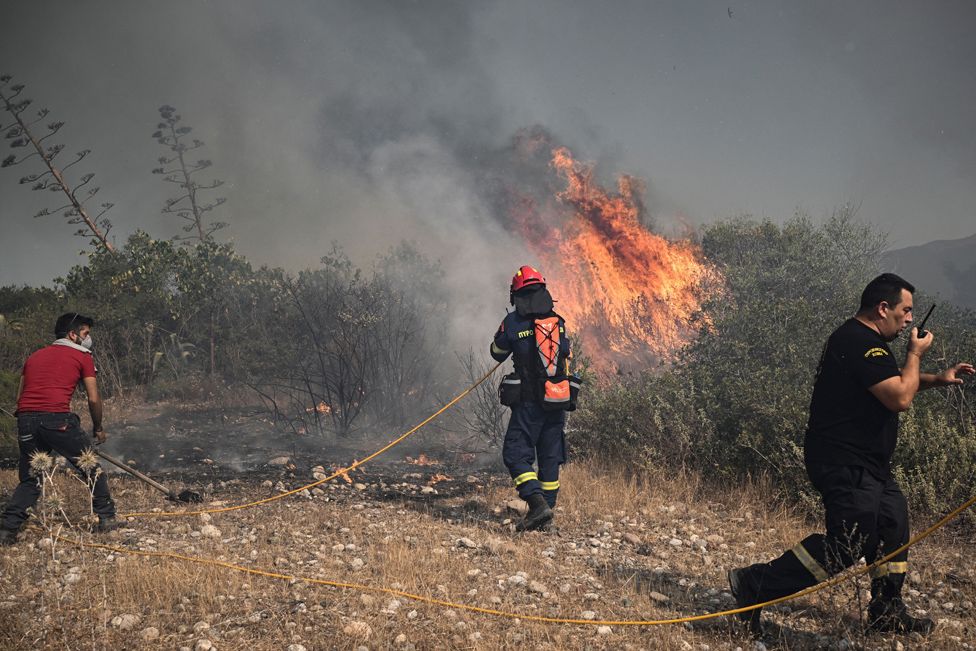 Firefighters and a civilian   effort   to extinguish wildfires adjacent   the colony   of Vati connected  the land  of Rhodes