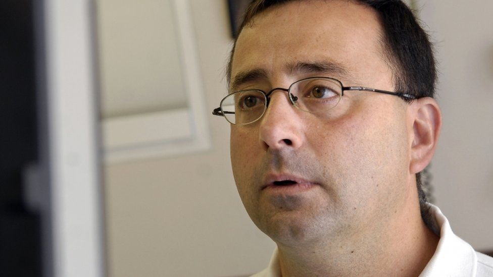 Larry Nasser looks at a computer after seeing a patient in this 2008 file photo.
