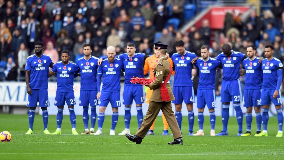 A poppy wreath is laid on the pitch before the Premier League match at the Cardiff City Stadium.