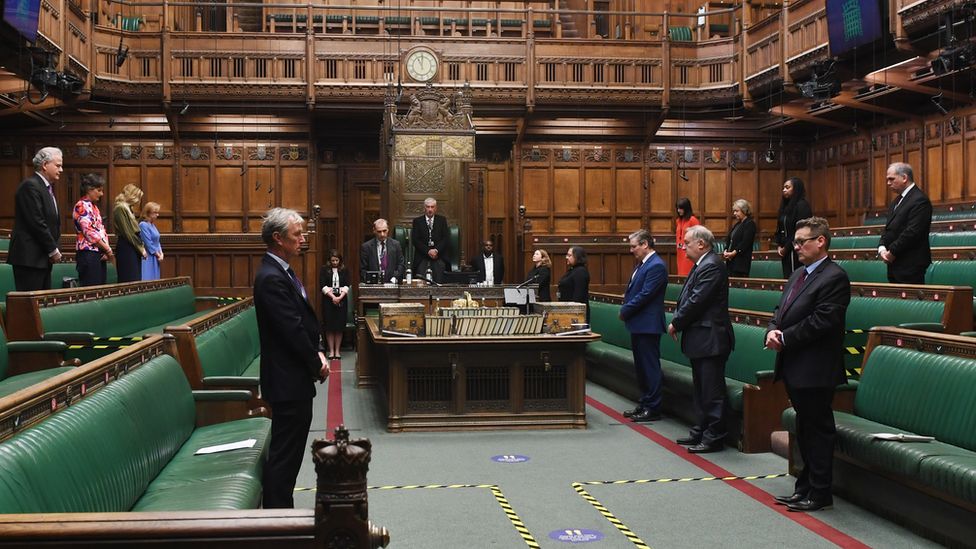 MPs in the Commons stand in silence