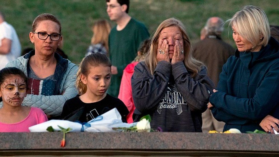 People gather to remember loved ones at the Columbine Memorial