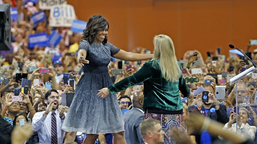 First Lady Michelle Obama goes to hug Carolyn Goldwater-Ross at a campaign rally for Hillary Clinton in Phoenix, Arizona - 20 October 2016