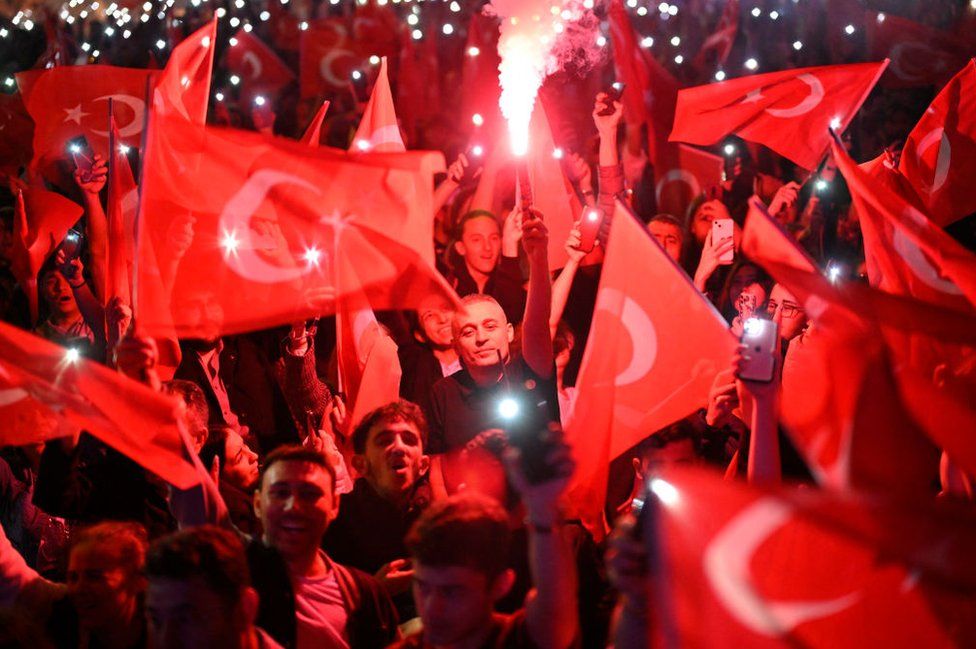 Opposition Republican People's Party (CHP) supporters celebrate outside the main municipality building following municipal elections across Turkey, in Istanbul on March 31, 2024.