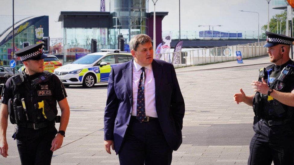Kit Malthouse and two Essex police officers
