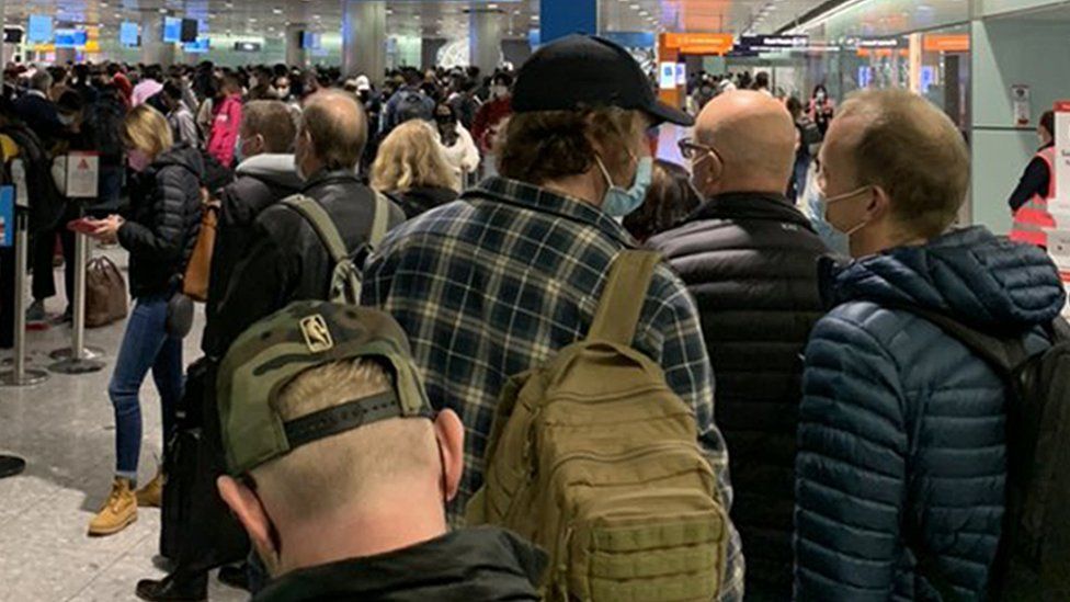 Passengers queue at Heathrow