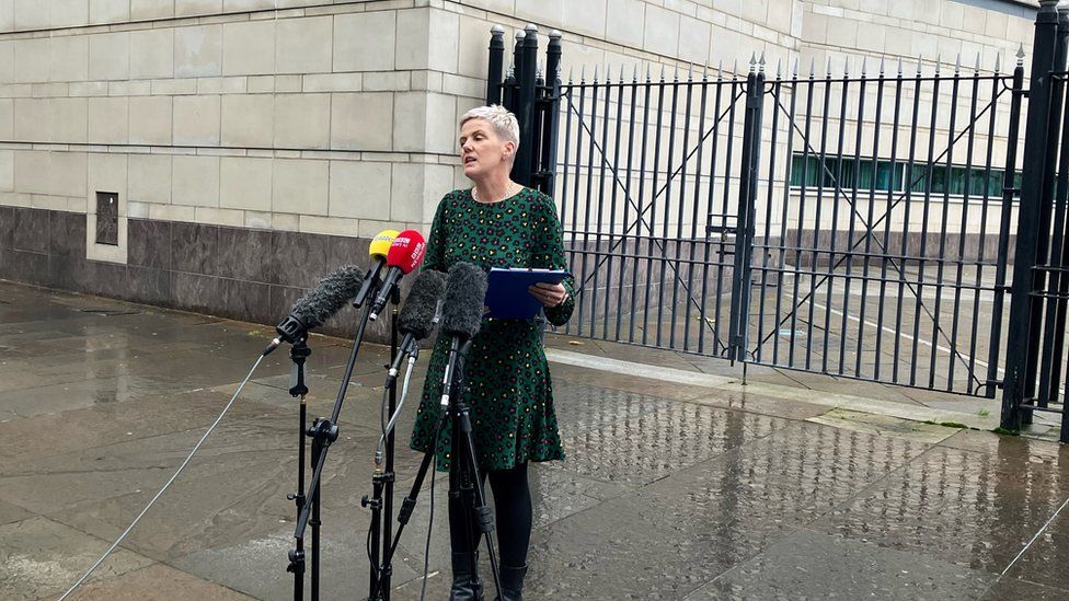 PSNI Det Insp Hazel Miller stands in front of microphones outside Belfast Crown Court