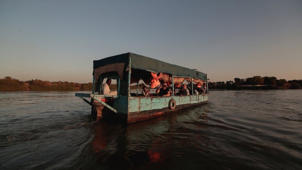 Tourists sail across the convergence between the White Nile river and Blue Nile river in Khartoum, Sudan, 15 February 2020