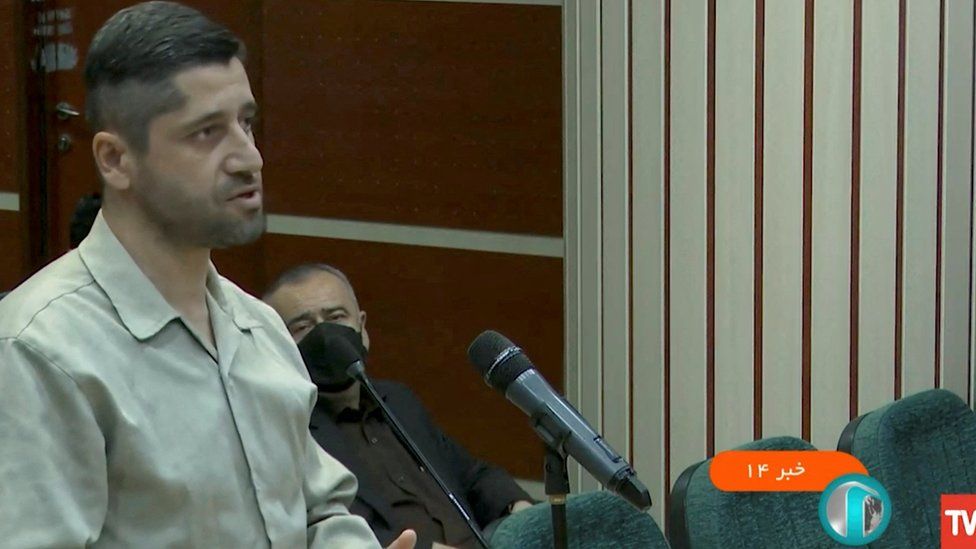 Seyed Mohammad Hosseini standing in court