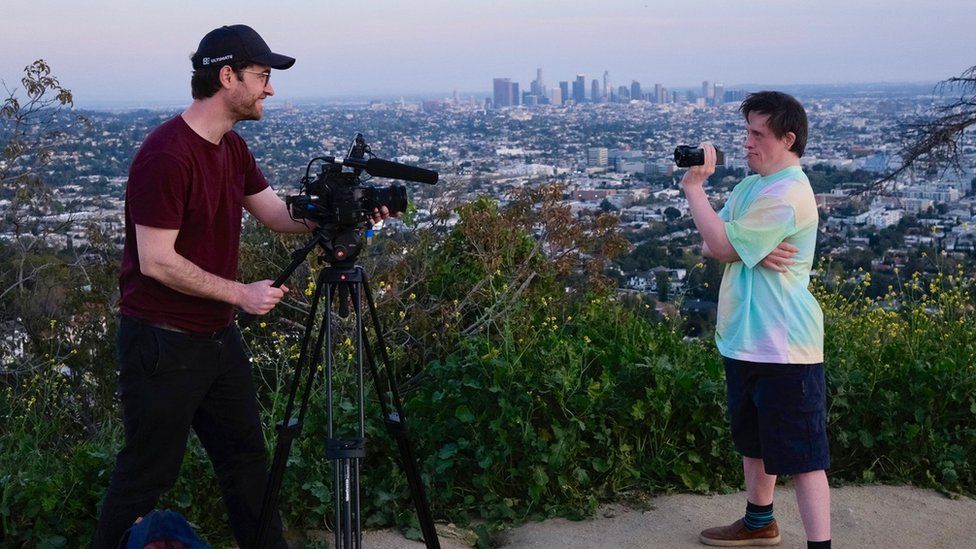 Will (l) and Tommy (r) filming each other with Los Angeles in the background