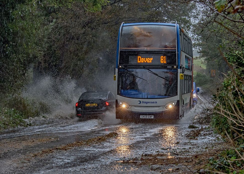 A bus makes its way through heavy rain in Dover, Kent, Britain, 02 November 2023.