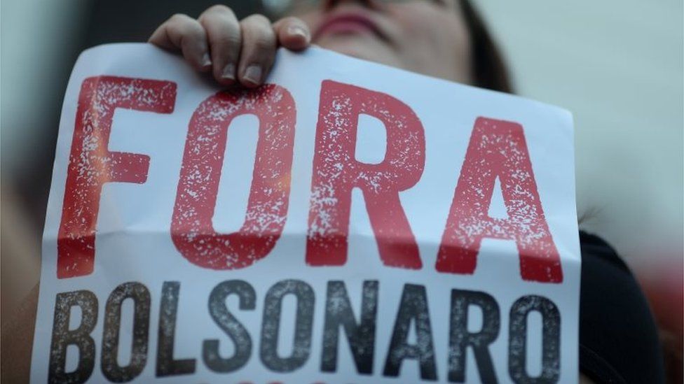 A woman holds a banner which reads "Bolsonaro out" as she takes part in a protest against celebrations marking the anniversary of a 1964 coup in Rio de Janeiro, Brazil March 31, 2019.