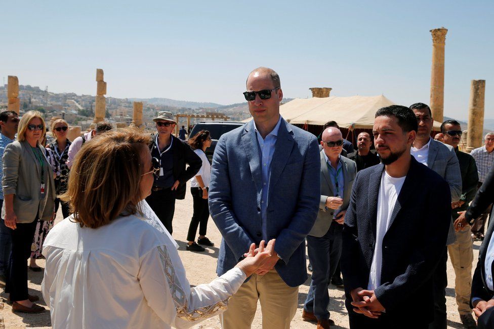 Prince William stands with Crown Prince Hussein during his visit to the ancient city of Jerash
