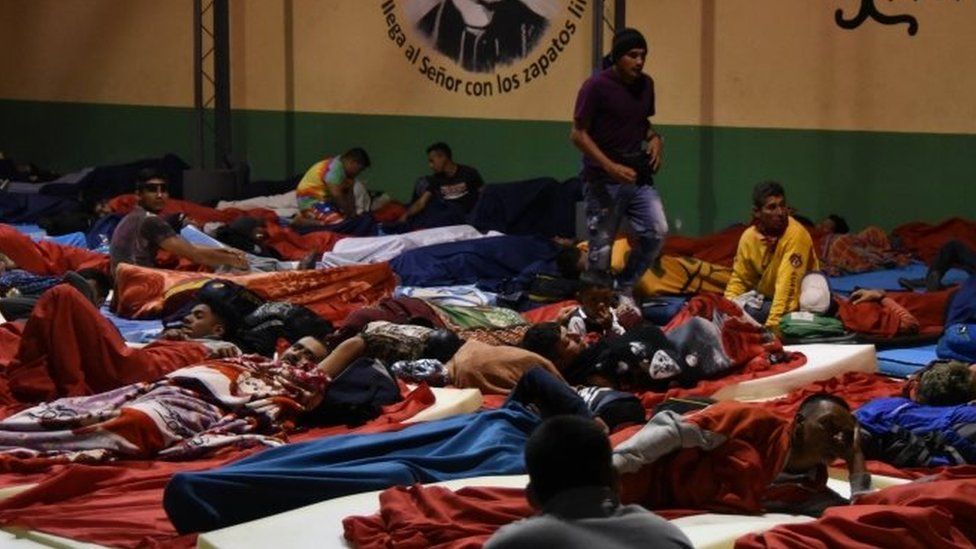 Migrants bed down for the night at a shelter in Guatemala City