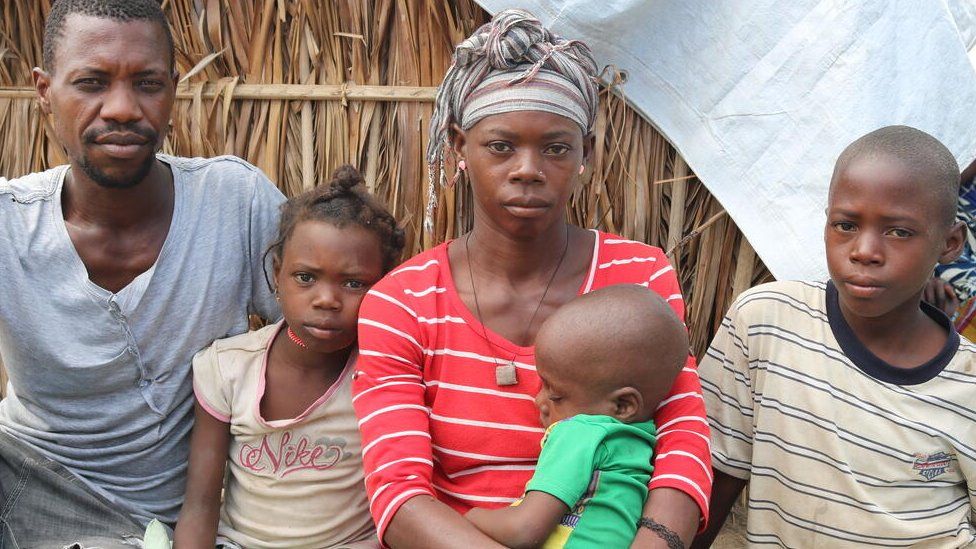A couple who fled militants in northern Mozambique with their three children - their eldest son was beheaded