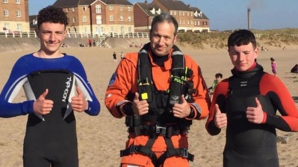 Theo and Jack with the coastguard