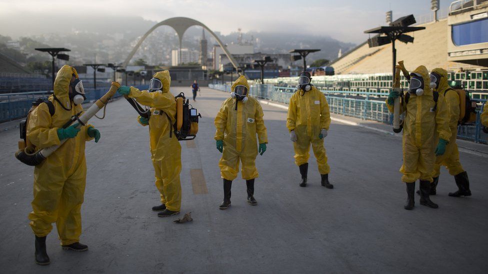 Health workers in Brazil fumigate a stadium in Rio