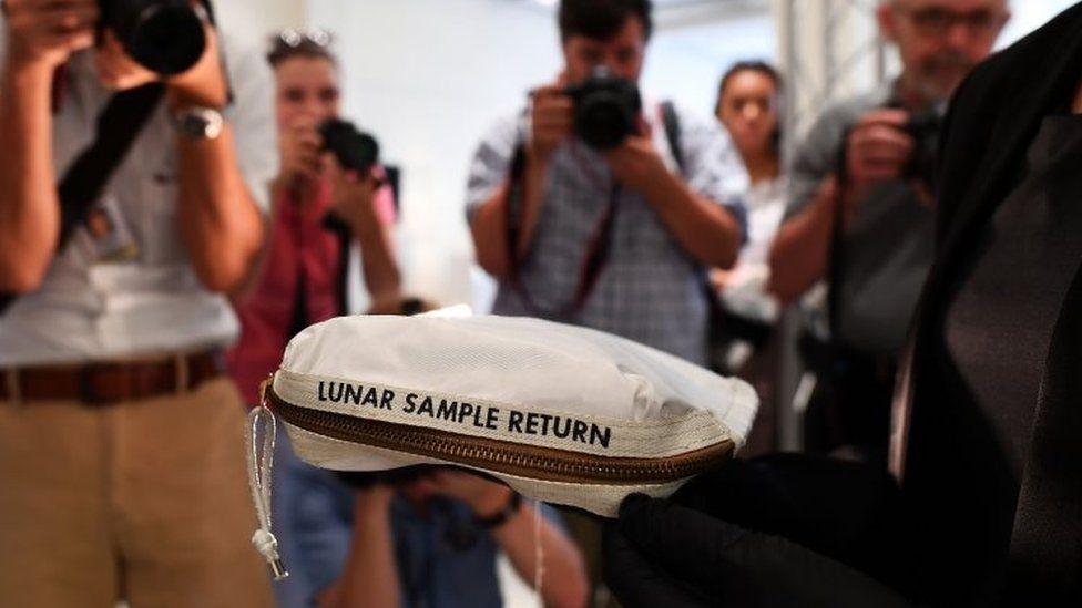 The bag used to collect samples of the Moon is displayed at Sotheby's