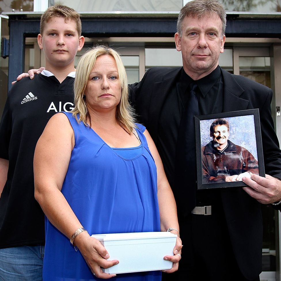 Lee-Anne Cartier carrying her brother Phil's ashes, with another brother, Andrew and a nephew