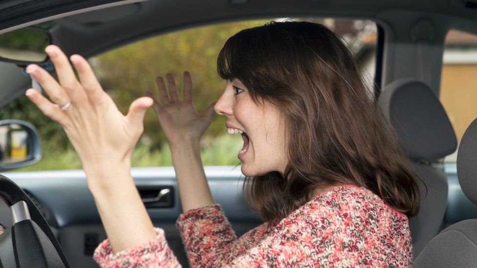 Woman getting angry in car generic