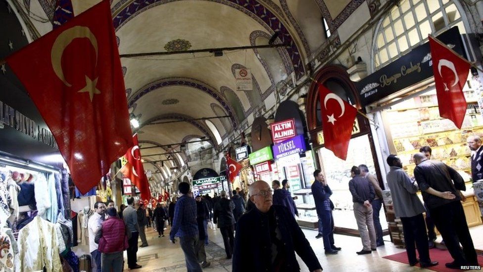 People walk through the Grand Bazaar in Istanbul