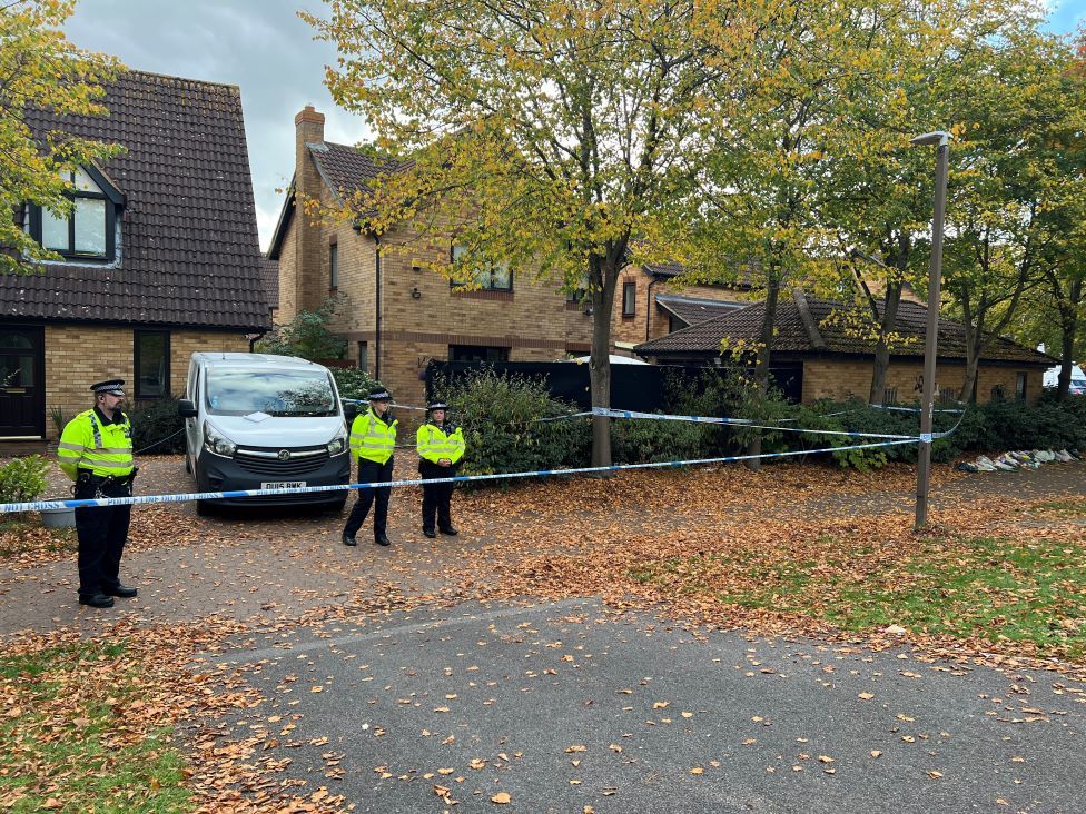 A black screen has been placed outside of the front of a house being searched in Loxbeare Drive, Milton Keynes