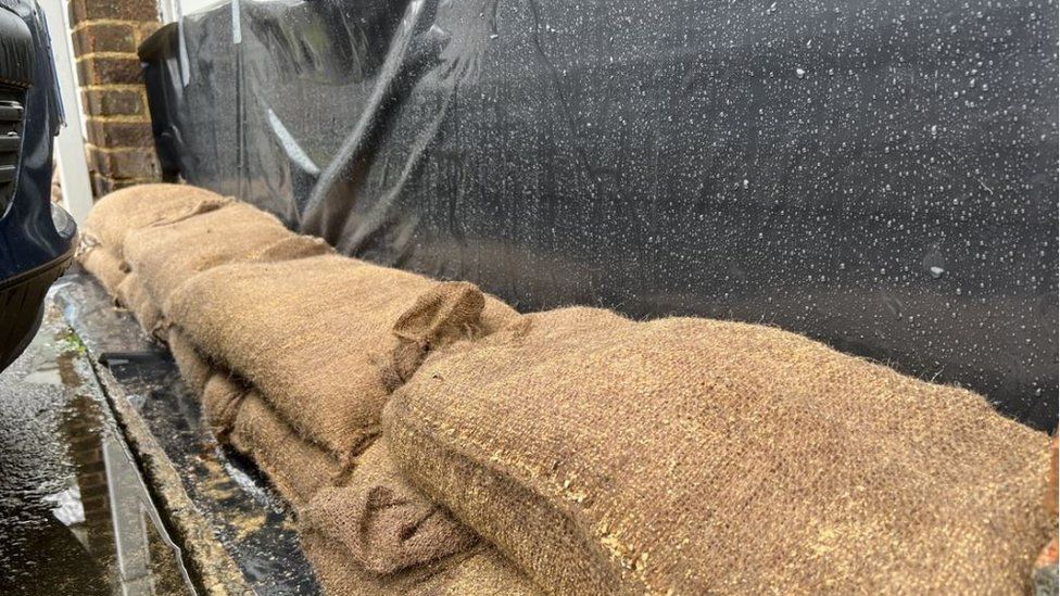 Sandbags next to a garage