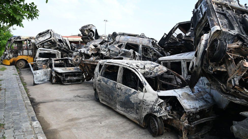 Vehicles damaged in Nuh clash parked at Nuh bus stand, at least 50 vehicles were torched after a massive communal violence in Nuh on August 1, 2023 in Nuh, India. Five people were killed and over 50 people including policemen were injured in Haryana after clashes broke out in Nuh district Monday. The violence began after a mob of miscreants pelted stones and set cars on fire during a religious procession on Monday evening.