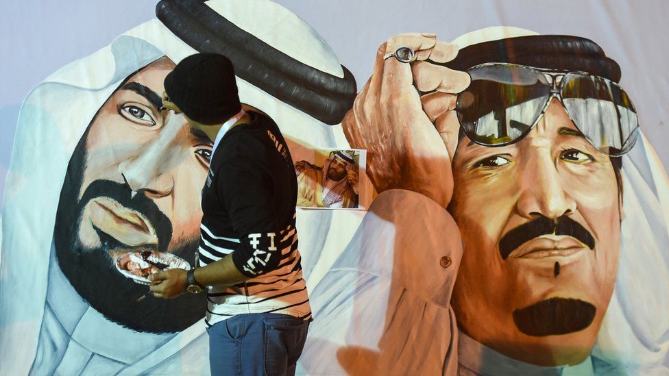 Saudi artists paint a mural portrait of King Salman bin Abdulaziz (R), and his son Crown Prince Mohammed bin Salman, during the 32nd Janadriyah Culture and Heritage Festival, held on the outskirts of the capital Riyadh on 17 February 2018.
