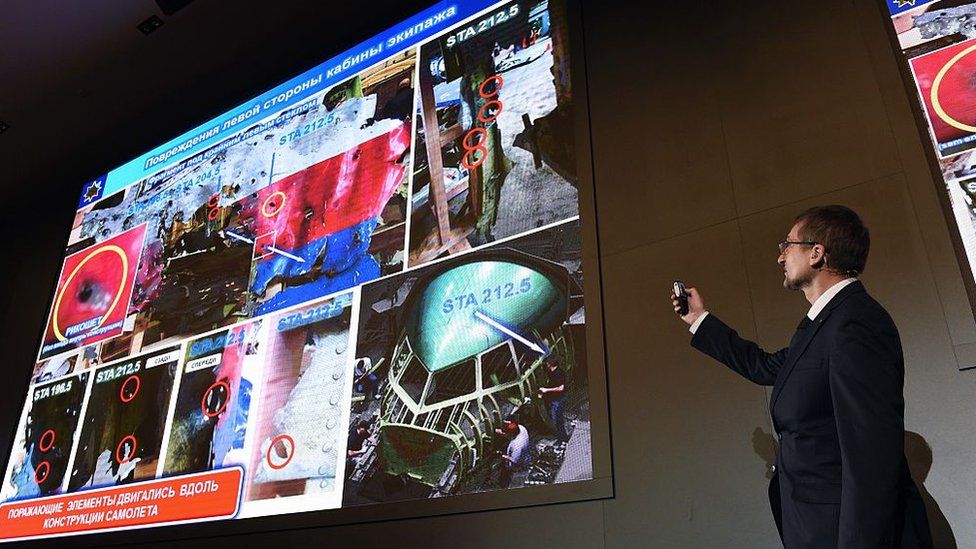 An official of Russia's missile maker Almaz-Antey presents the results of the companys investigation into the downing of Malaysia Airlines flight MH17 at a press conference in Moscow on October 13, 2015