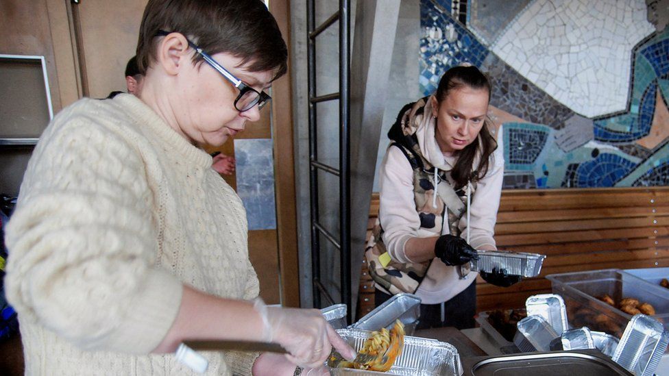 Volunteers prepare food in Kharkiv, 11March 2022.