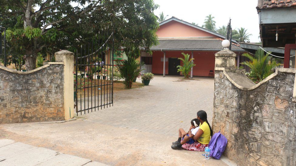 Chandani de Souza and her son at the school gates