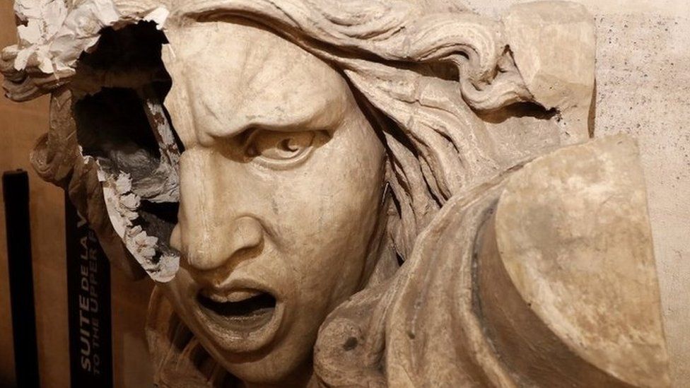 A vandalised statue of Marianne, a symbol in France, seen inside the Arc de Triomphe after Paris riots