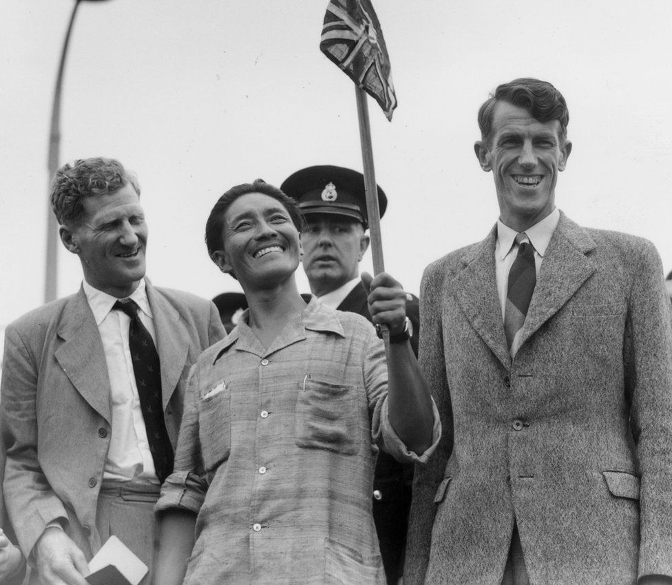 3rd July 1953: From left to right, Colonel John Hunt, Tenzing Norgay (better known as Sherpa Tensing), and Edmund Hillary make a jubilant return to Britain after becoming the first men to scale Mount Everest. (Photo by George W. Hales/Fox Photos/Getty Images)