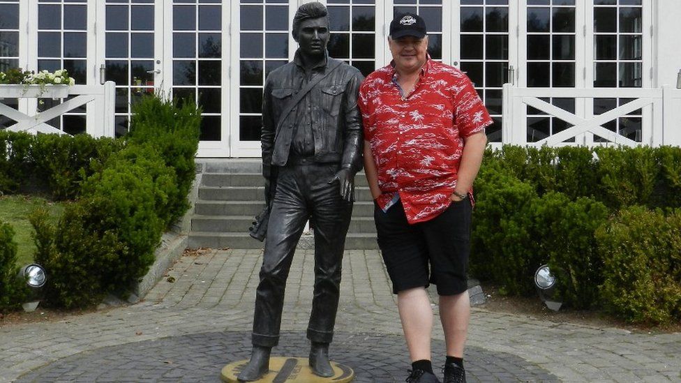 Henrik Knudsen and Elvis statue outside the Dane's extensive tribute to the King