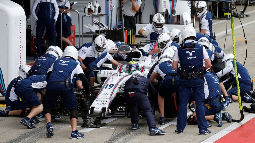 The Williams team work on a car at Silverstone in 2017