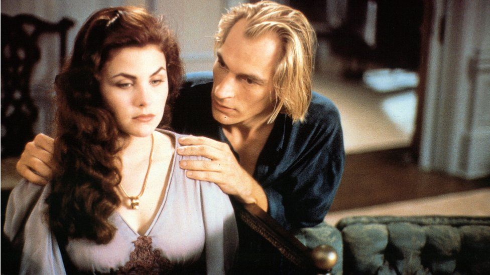 Sherilyn Fenn sits as Julian Sands holds her shoulders in a scene from the film 'Boxing Helena', 1993
