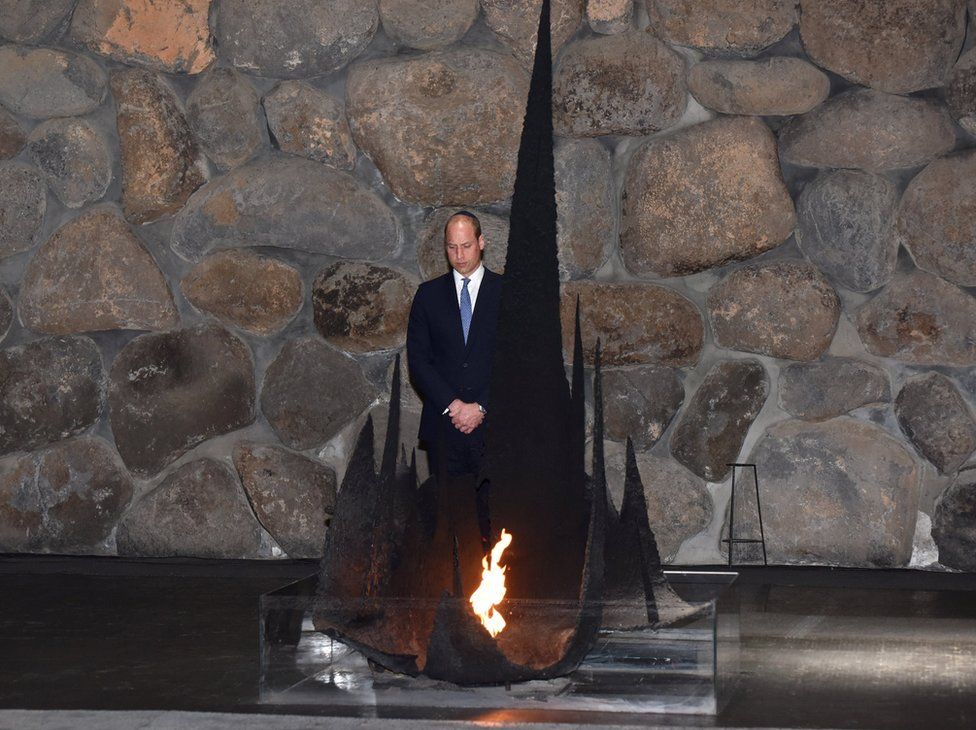 Prince William stands next to the eternal flame during a ceremony commemorating the six million Jews killed by the Nazis during the Holocaust, in the Hall of Remembrance at Yad Vashem World Holocaust Remembrance Center in Jerusalem