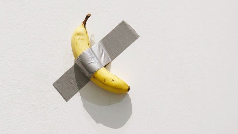 A general view shows 'Comedian', a banana duct-taped to a wall, during the solo exhibition by Italian artist Maurizio Cattelan at UCCA Great Hall on November 20, 2021 in Beijing, China.