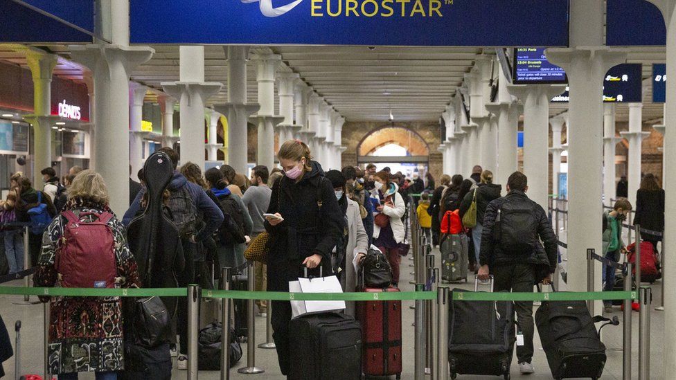 People at St Pancras Station in London, travelling to France ahead of the introduction of tougher rules for visitors from the UK in an attempt to counter the spread of the Omicron variant of coronavirus.