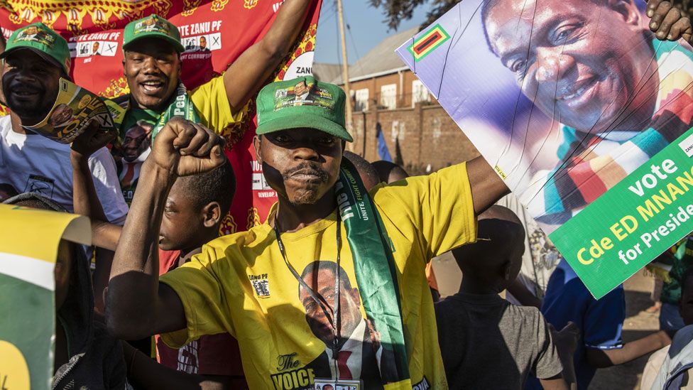 A Zanu-PF supporter in Zimbabwe celebrating