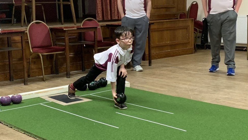 Seven-year-old short mat bowls player, Hari, from Trimsaran