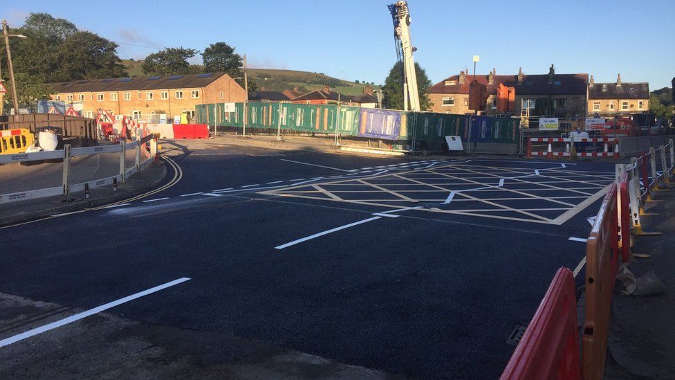 Red and white barriers on Burnley Road