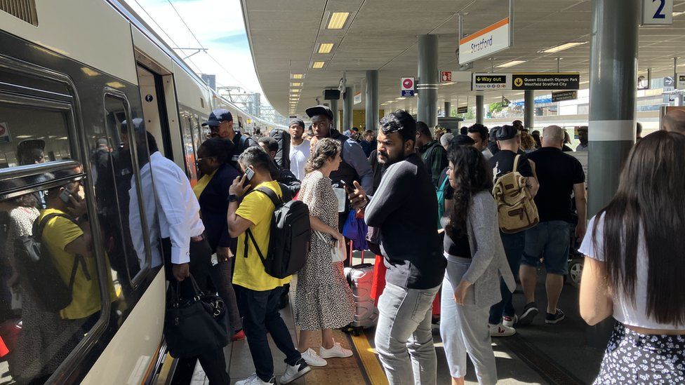 Passengers on platform at Stratford station