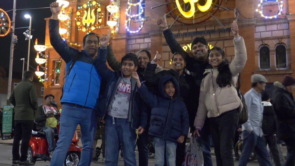 Family enjoy lights switch-on