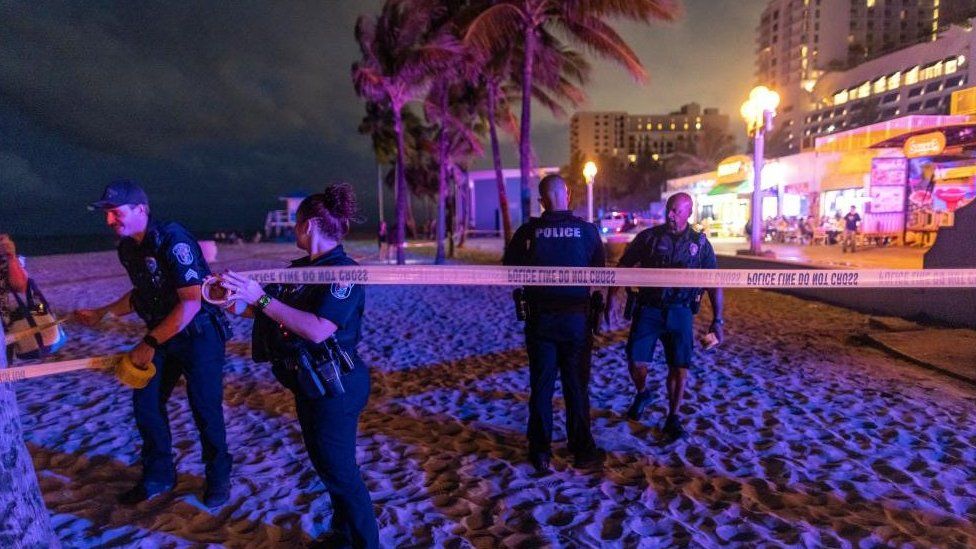 Police officers close off the area where gunfire broke out along a beach boardwalk in Hollywood, Florida, USA, 29 May 2023. A City of Hollywood spokesperson confirmed 9 people were transported to area hospitals with gunshot wounds.