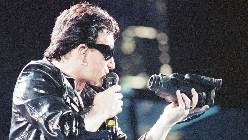Bono of U2 performing in Cardiff